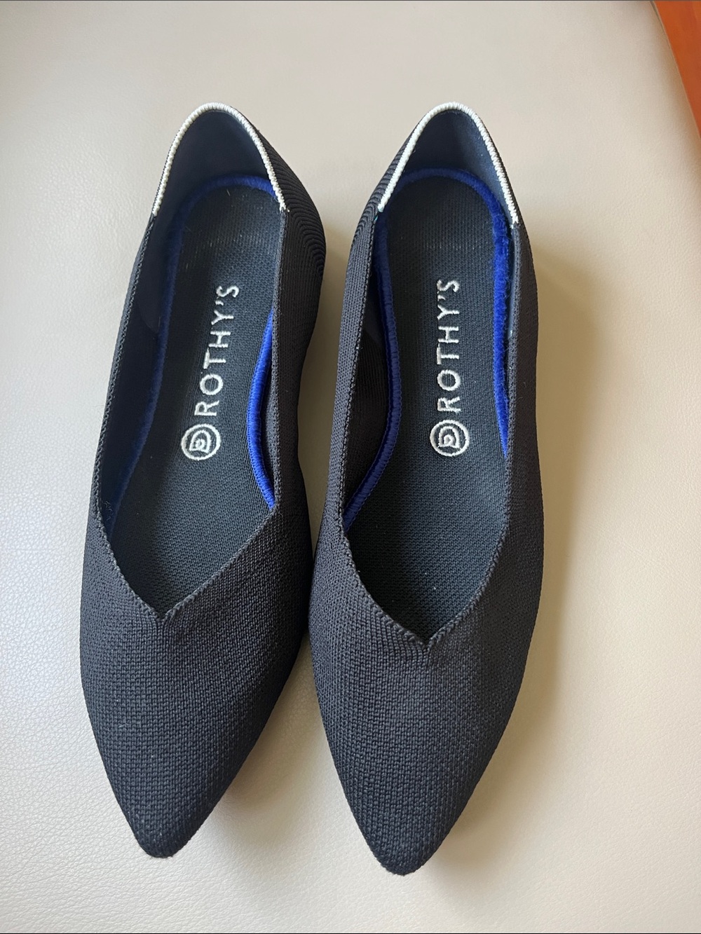 Rothy's Black Pointed Knit Flats with white ankle Trim